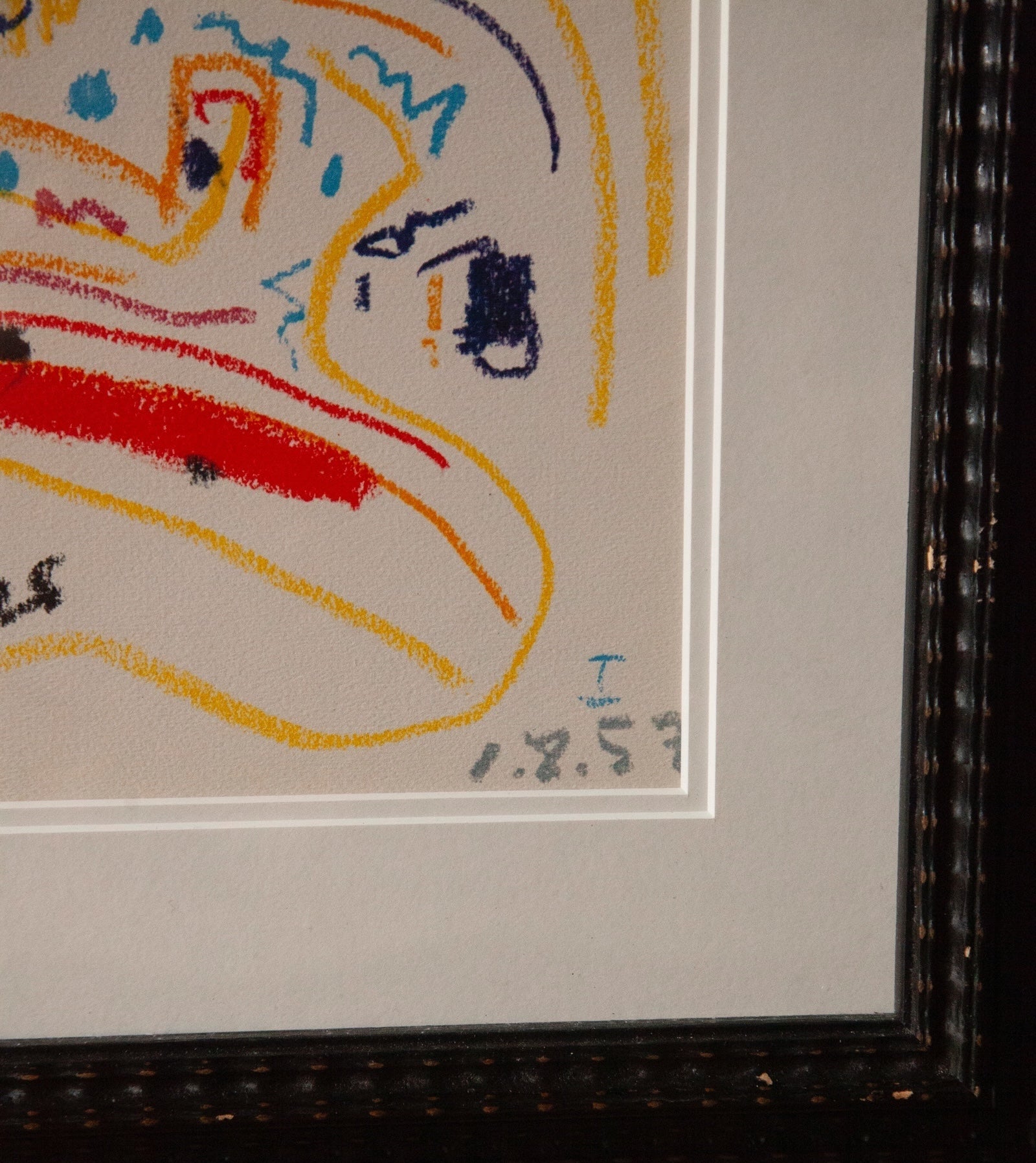 Framed artwork with a colorful abstract design on a plain background