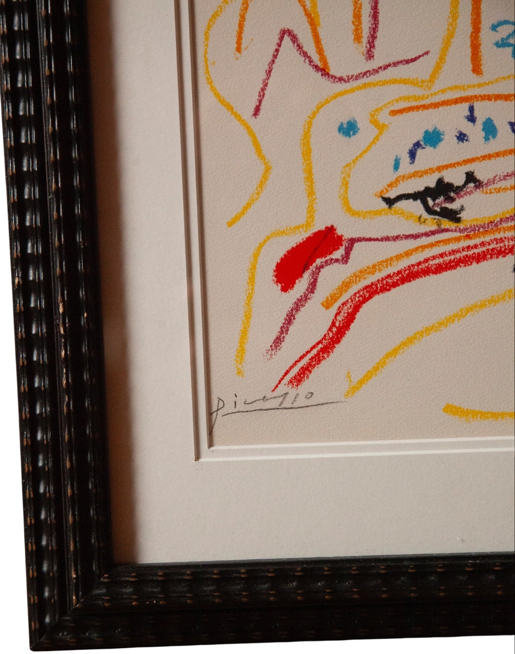 Framed artwork with a colorful abstract design on a white background